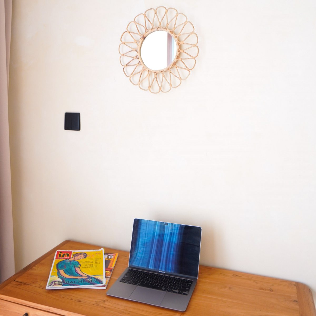 Small rattan mirror adding cozy style to home décor by CozyVibe