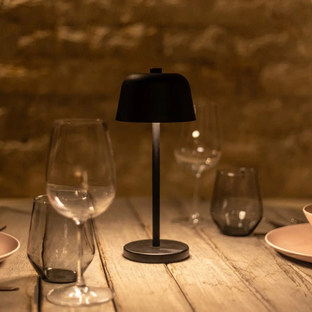 Black Anton Lamp creating elegant atmosphere on dining table