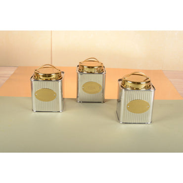 Set of Aulica silver and golden coffee boxes displayed on kitchen counter