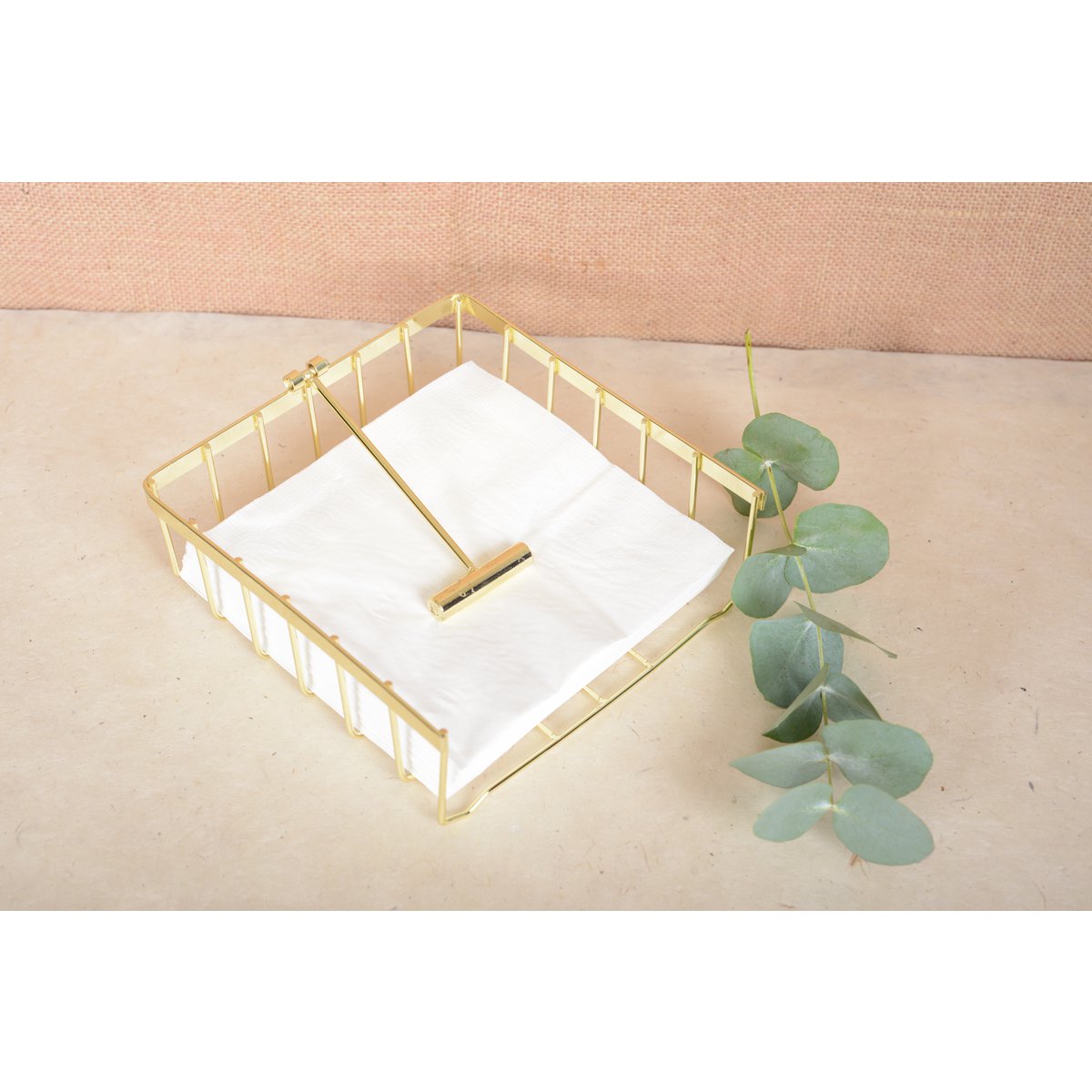 Stylish golden towel holder perfect for elegant dining presentation