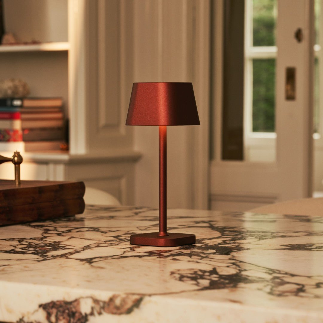 Ava Bronze portable lamp shown in compact handheld design