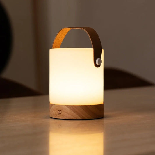 Elegant Avery Lamp providing warm cordless light for cozy interiors
