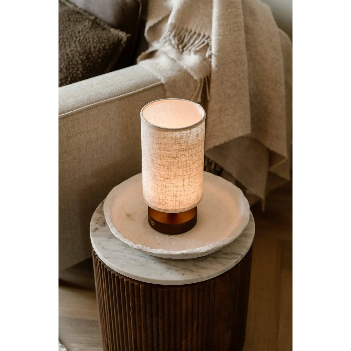 User adjusting light intensity on dimmable Ben Lamp with touch button