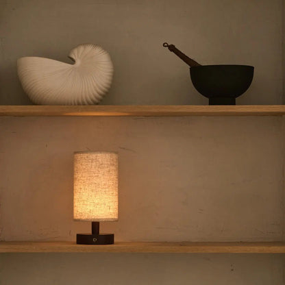 Softly glowing Ben Lamp adding warmth to natural wood surface