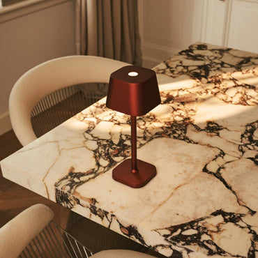 Ava Bronze cordless table lamp creating warm dining table light