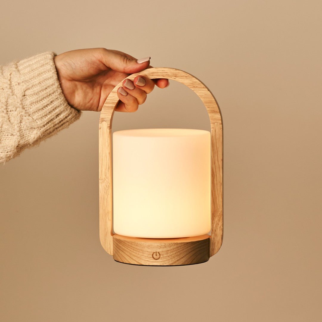 George Light Brown rechargeable lamp shown in comfortable handheld use