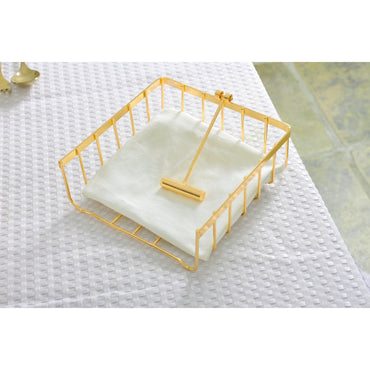Modern gold wire napkin holder adding style to dining table