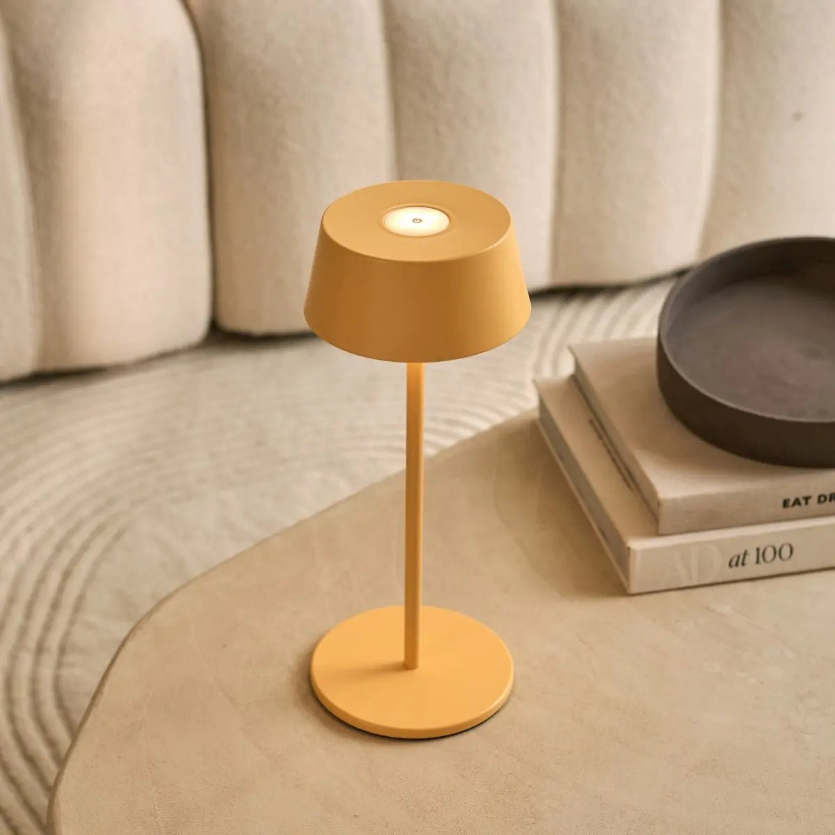 Small Hugo Lamp on nightstand providing soft adjustable bedside light