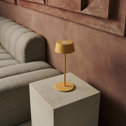 Amber Hugo Lamp enhancing cozy living room with warm light tone