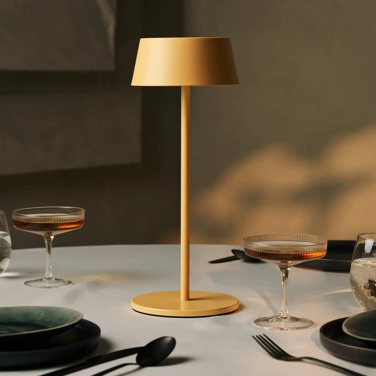 Stylish Hugo Amber Yellow Lamp adding warm glow to dining table