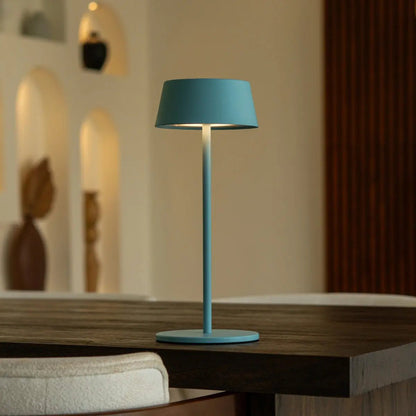 Blue Hugo Lamp creating cozy warm ambiance in living space