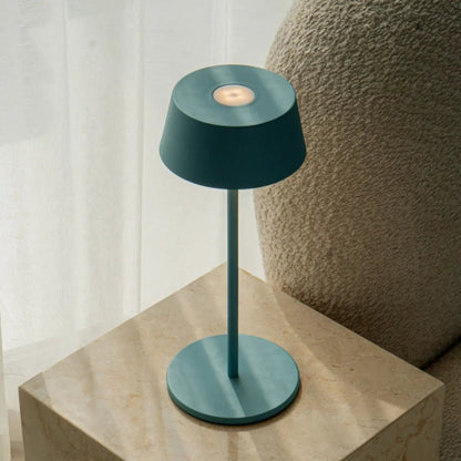 Elegant Hugo Lamp in Amsterdams Blue adding charm to bedroom decor