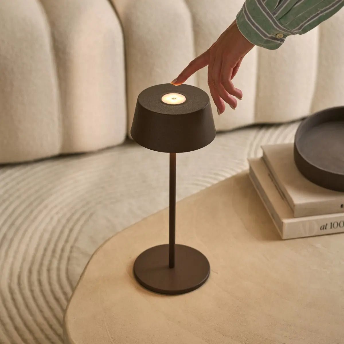 Minimalist Hugo Lamp adding soft illumination to living room space