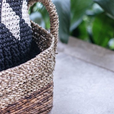 Kapauku seagrass banana fibre basket close-up of woven texture and handle