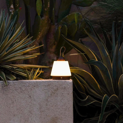 Liv Dark Brown rechargeable lamp creating cozy outdoor evening ambience