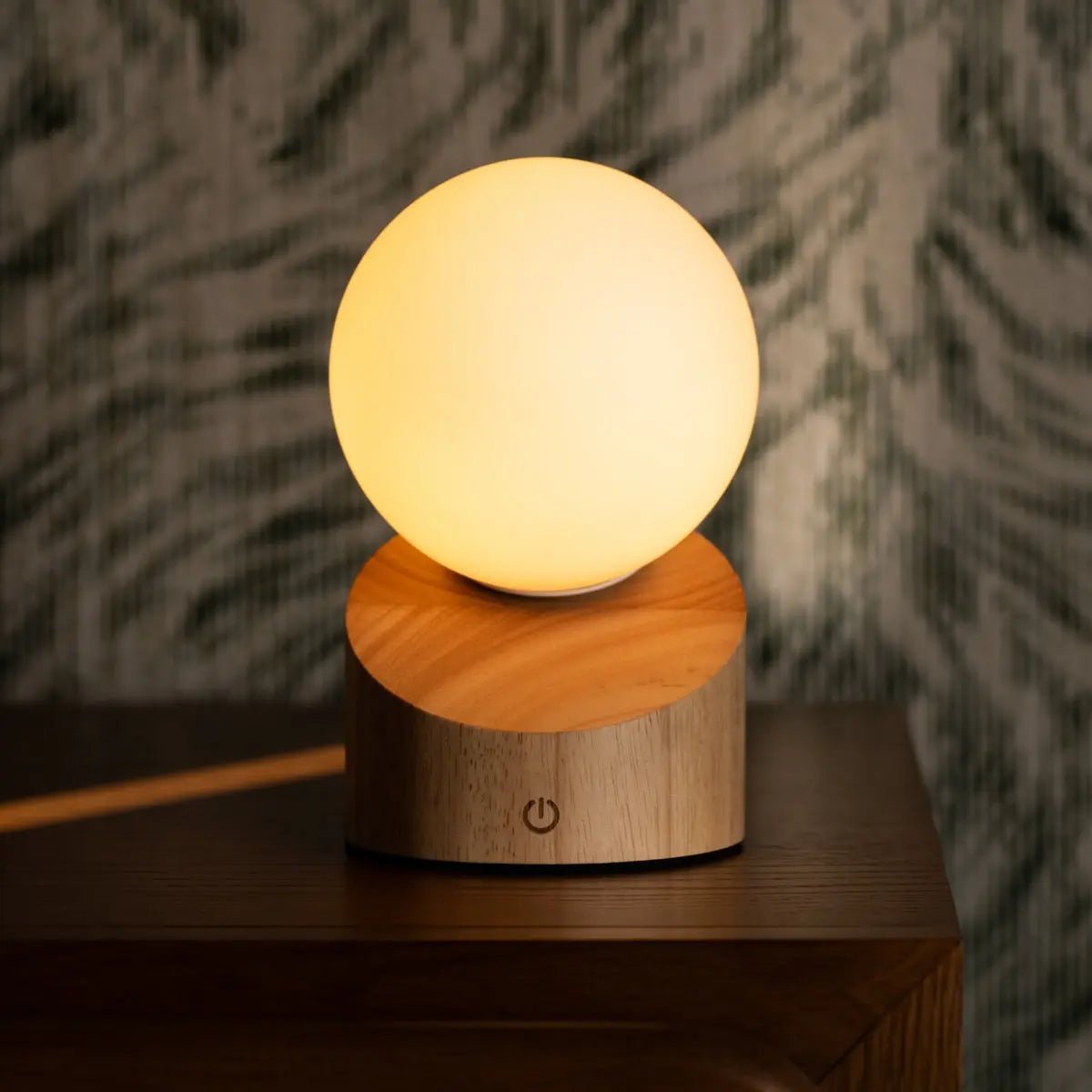 Morris Light Brown Lamp glowing softly with frosted glass shade
