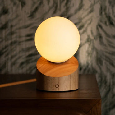 Morris Light Brown Lamp glowing softly with frosted glass shade