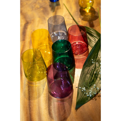 Multicolor water glasses displayed on festive dining table