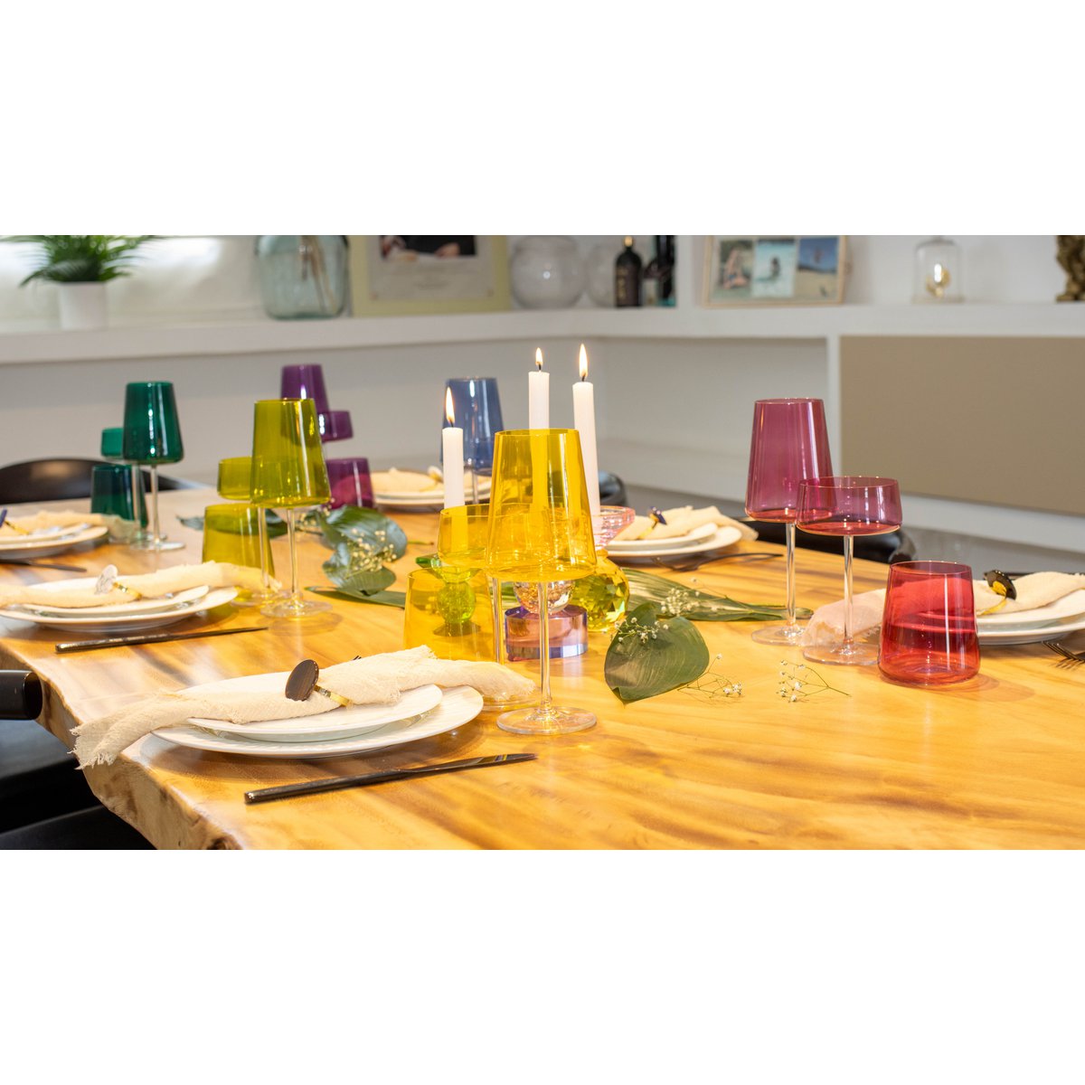 Multicolor wine glasses displayed on stylish dining table