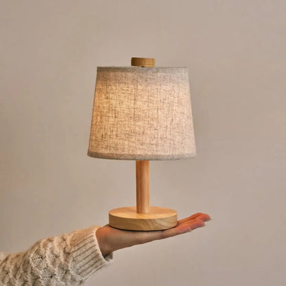 Rover Light Brown cordless lamp shown in elegant handheld design