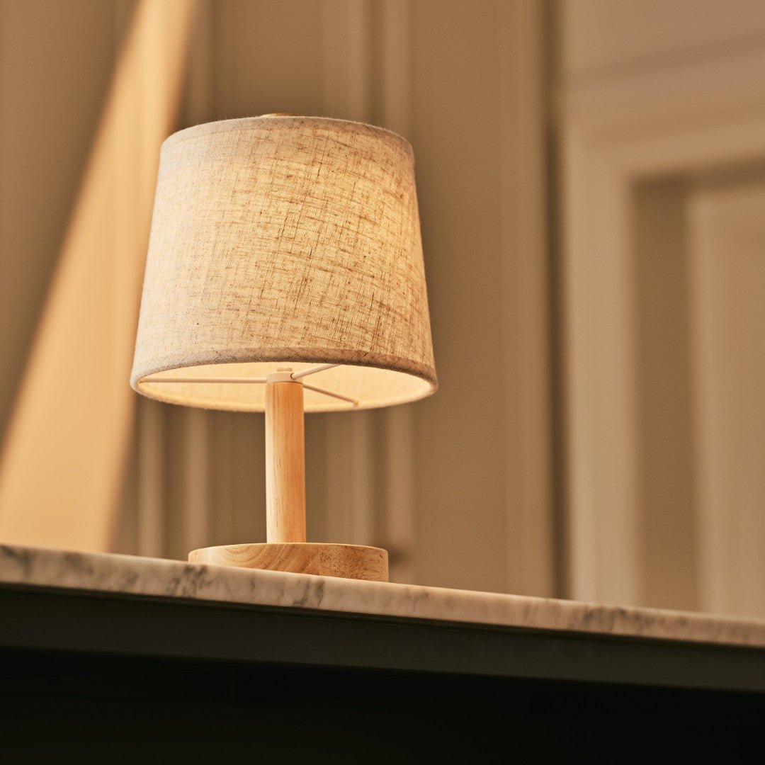 Rover Light Brown wooden rechargeable lamp glowing on marble table