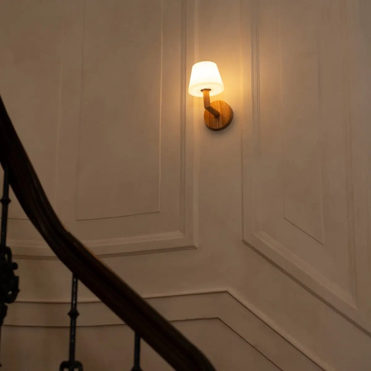 Ted wooden rechargeable wall lamp illuminating stairway area