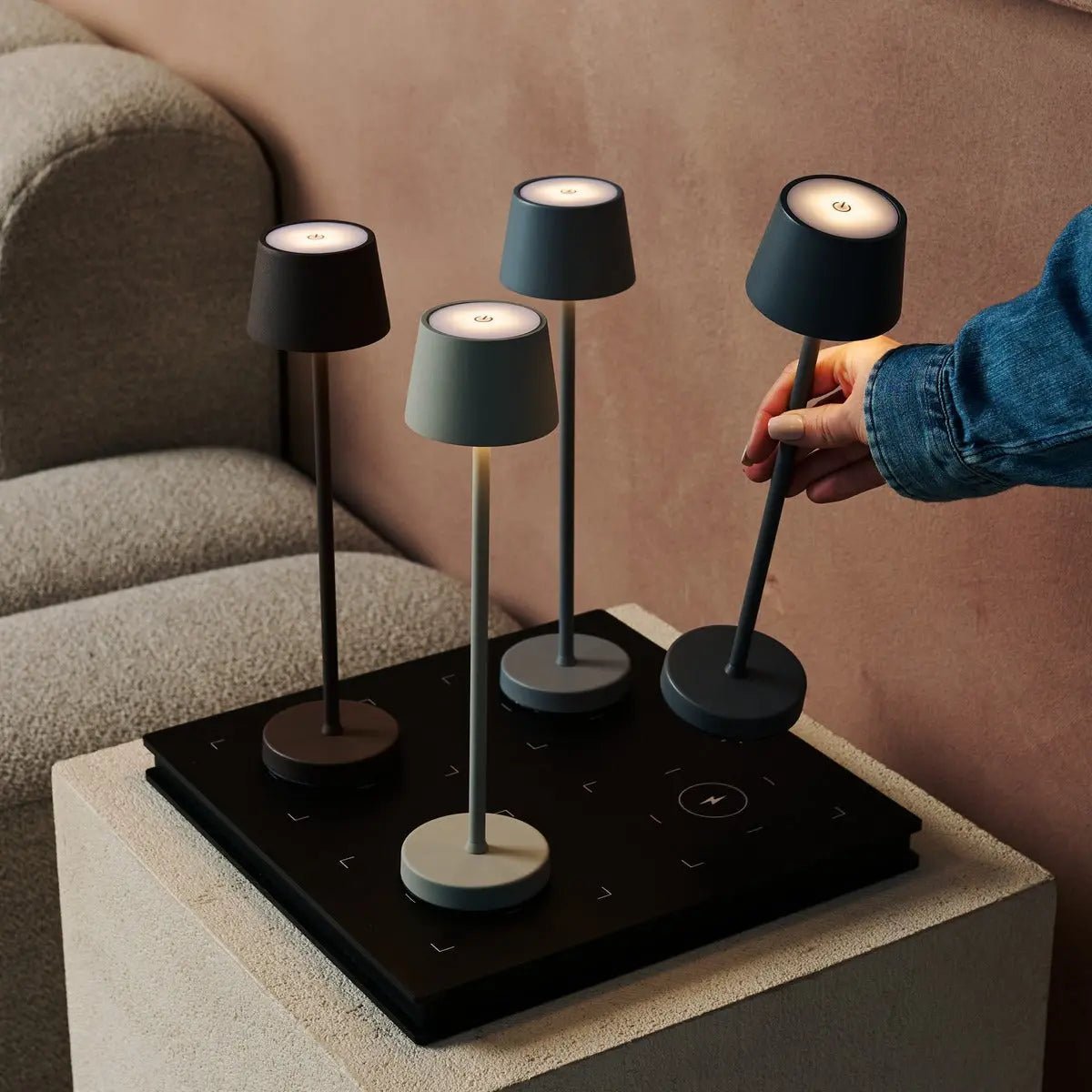 Vondel Mocha Brown rechargeable lamp shown in convenient handheld use