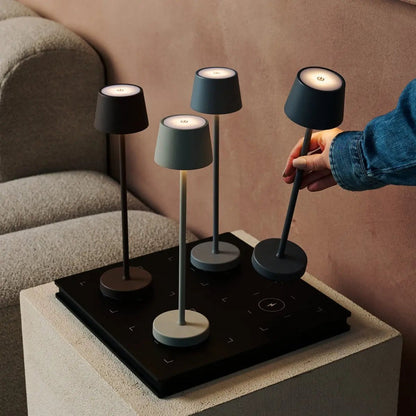 Vondel Mocha Brown rechargeable lamp shown in convenient handheld use