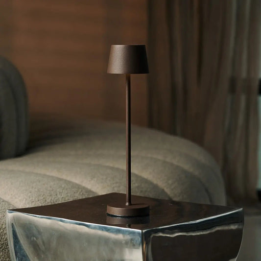Vondel Mocha Brown rechargeable lamp standing on modern metal table