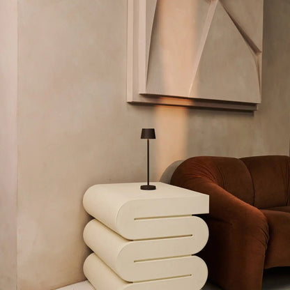 Vondel Mocha Brown wireless lamp placed beside stylish modern sofa