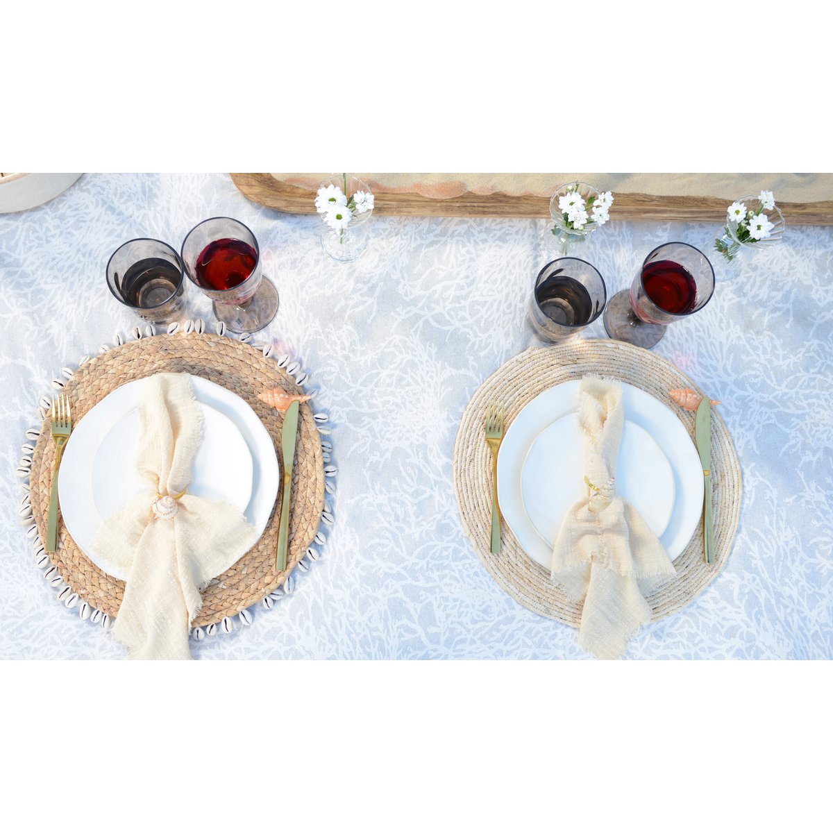 Boho wicker placemat decorated with shells for beach-inspired dining