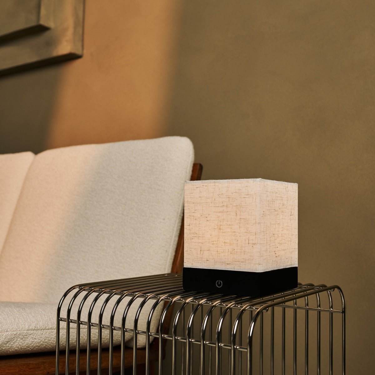 Zano Black cordless table lamp adding warm light to living room