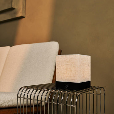 Zano Black cordless table lamp adding warm light to living room