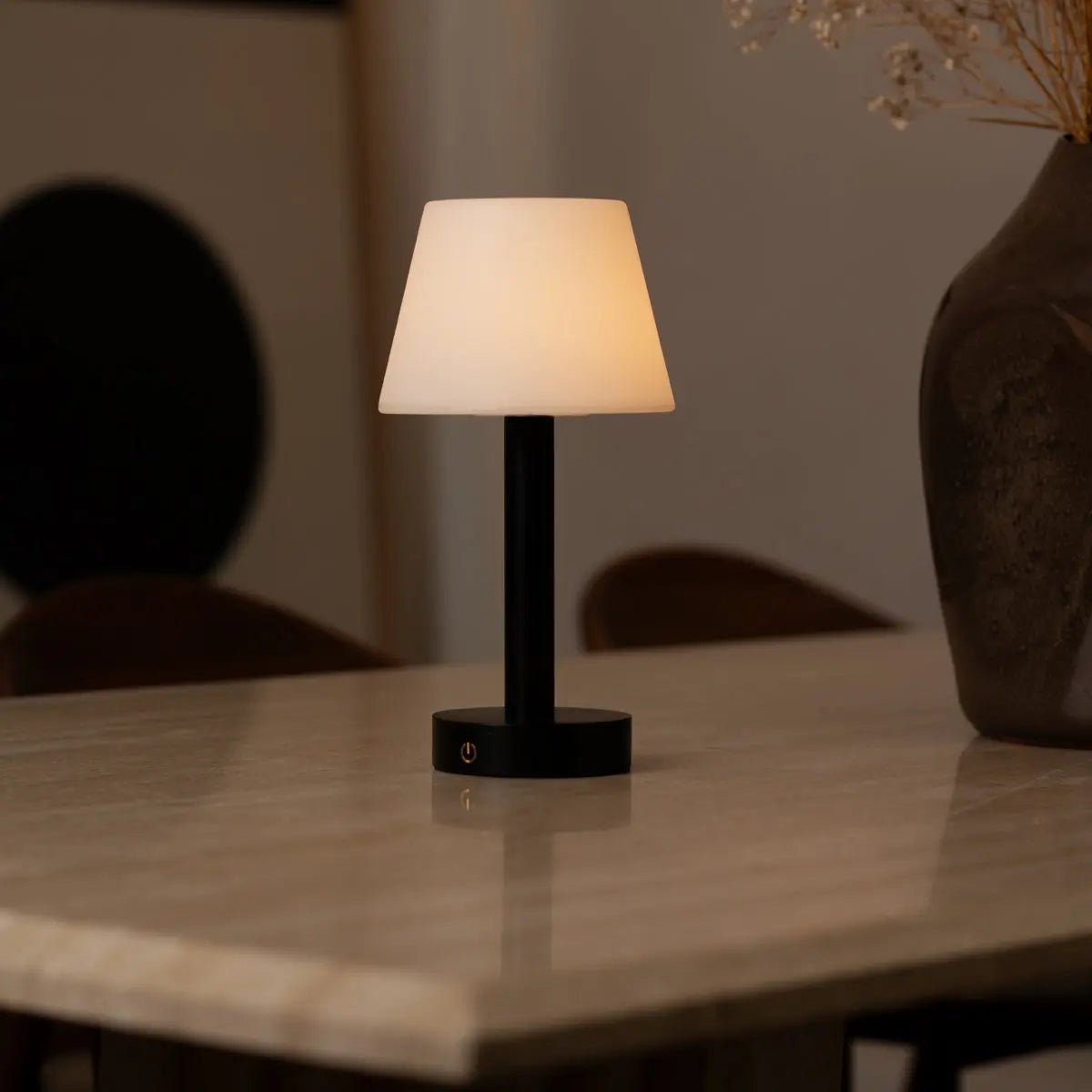 Zoë Black rechargeable lamp styled in a modern interior setup