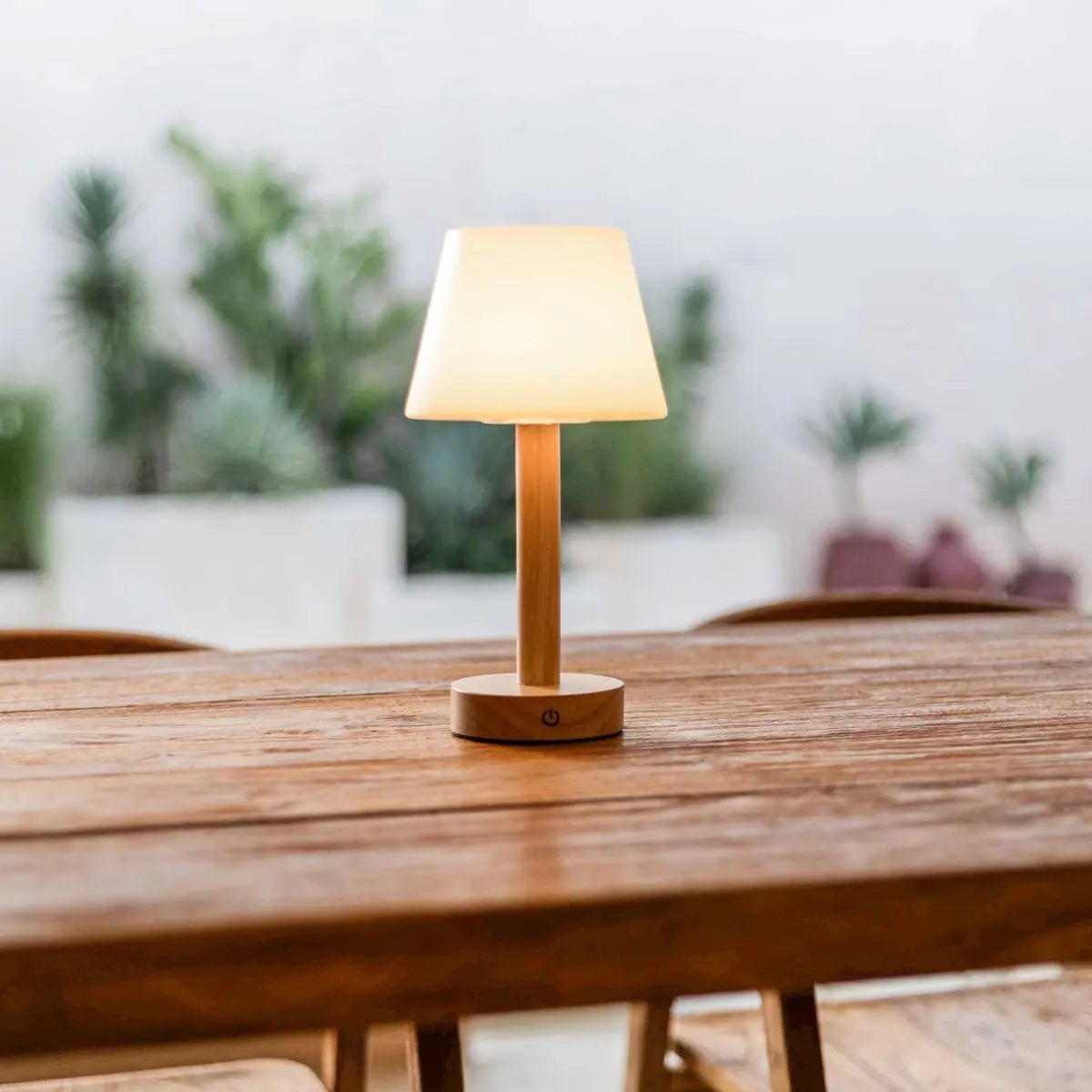 Zoë Light Brown wooden rechargeable lamp glowing on wooden table