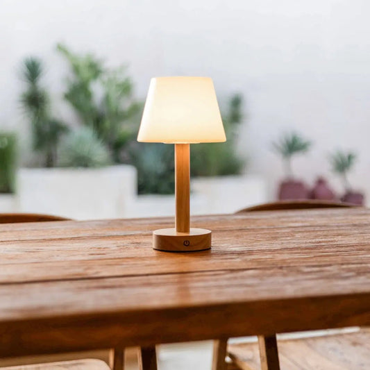 Zoë Light Brown wooden rechargeable lamp glowing on wooden table