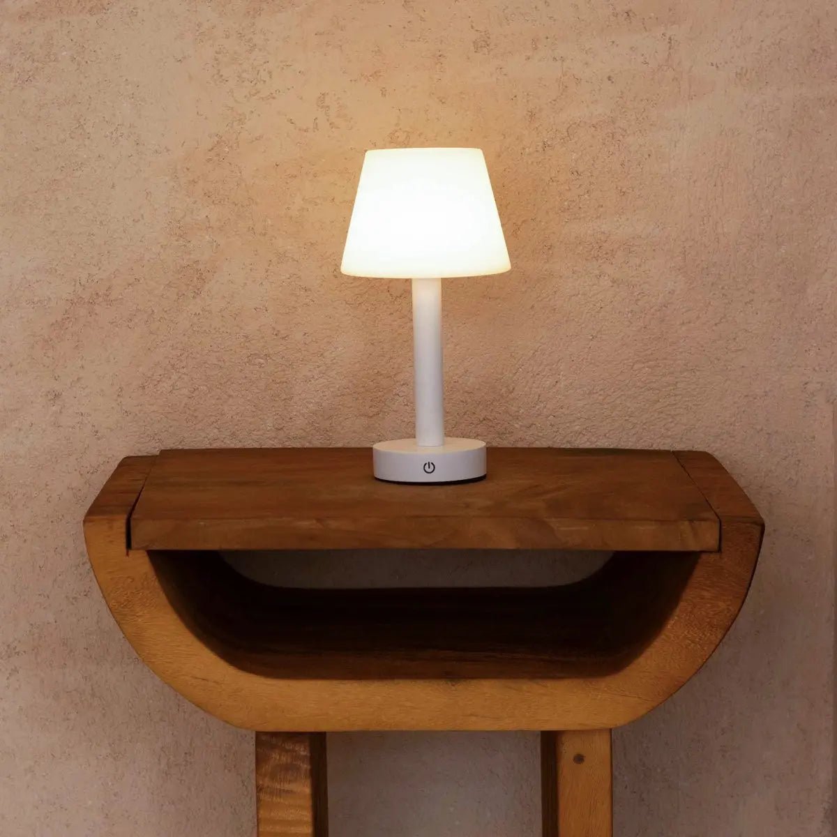 Zoë White cordless lamp displayed on small decorative wooden shelf