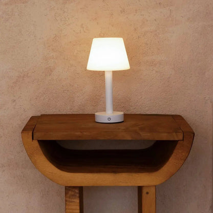 Zoë White cordless lamp displayed on small decorative wooden shelf