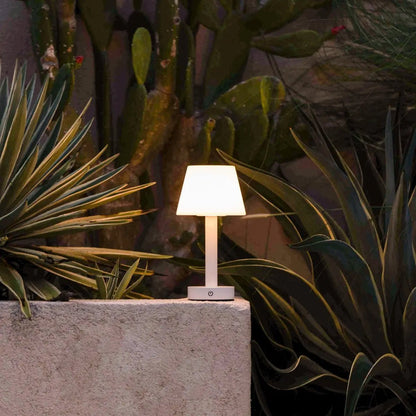 Zoë White rechargeable lamp creating soft outdoor evening lighting