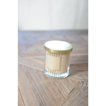 Brown candle with golden cover coconut perfume