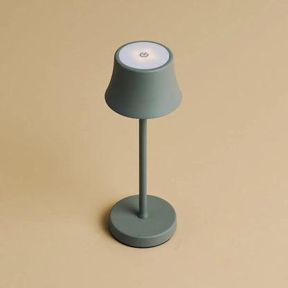 De Pijp Mini – Rechargeable Table Lamp – Small portable lamp placed on wall shelf with warm glow