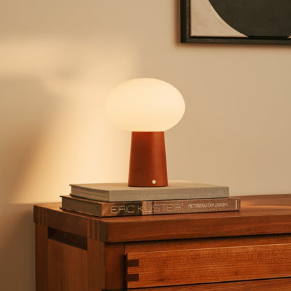 Max Chestnut – Wooden Lamp – Rechargeable chestnut lamp on cabinet with warm glow