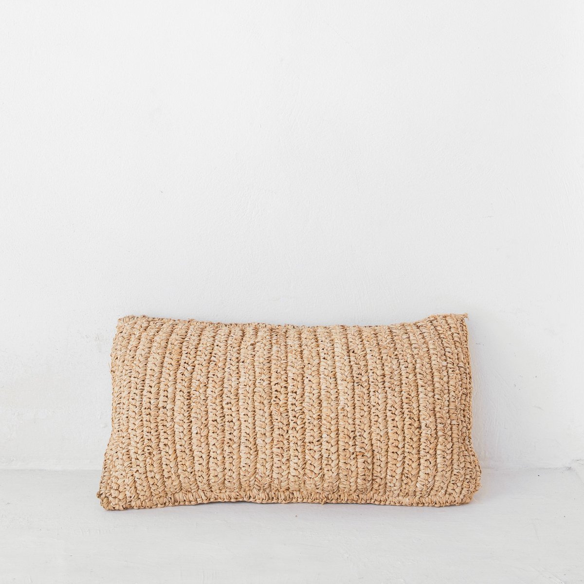 Raffia basket cushion for minimalist natural room decor