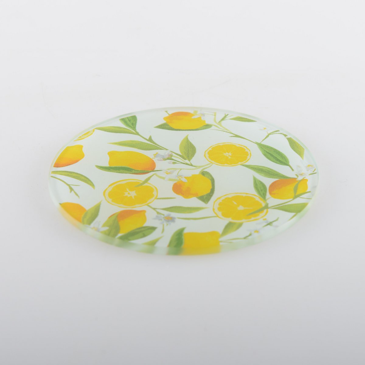 close up of lemon glass coaster with yellow citrus pattern