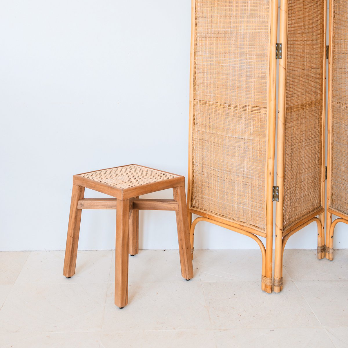 SUBANG rattan basket stool used as decorative seat or side table