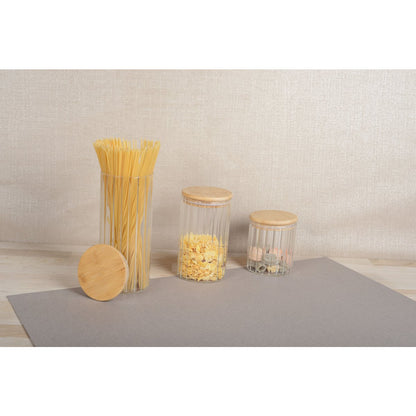 Stylish transparent glass canister with natural wooden lid for pantry use