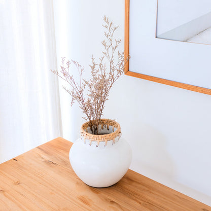 TUBAN clay basket vase used as decorative accent in living room