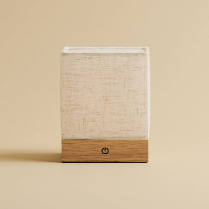 Natural-style table lamp with wooden base and linen shade, battery powered
